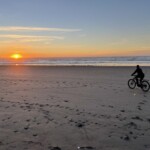 Beach biking at sunset