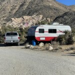 A Camp host shows the flag